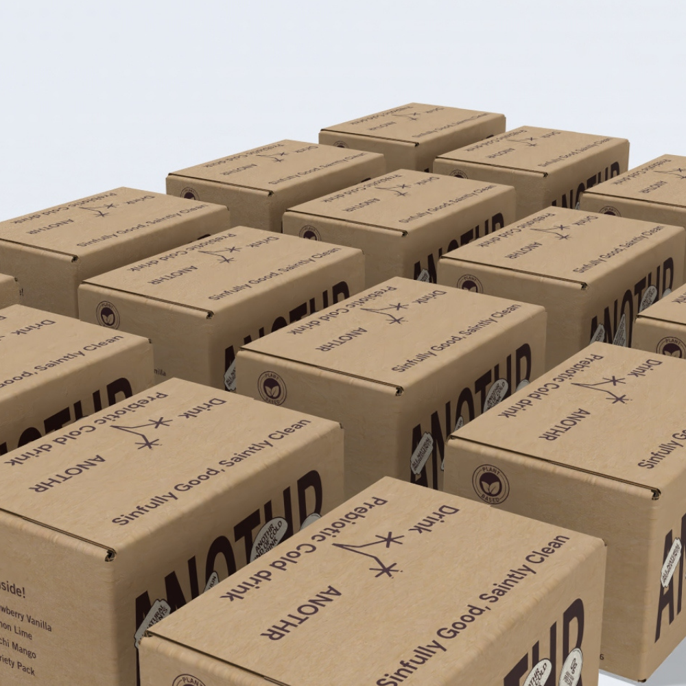 Stacked ANOTHR prebiotic drink cardboard shipping boxes with brand logo and sustainability markings