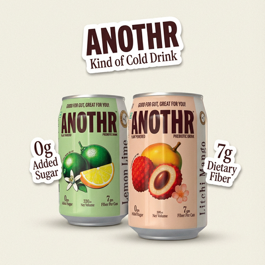 Two cans of 'ANOTHR' cold drink with fruit illustrations and health benefits text on a beige background.